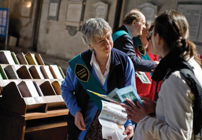 Guide welcomes visitors to Salisbury Cathedral - photo Ash Mills
