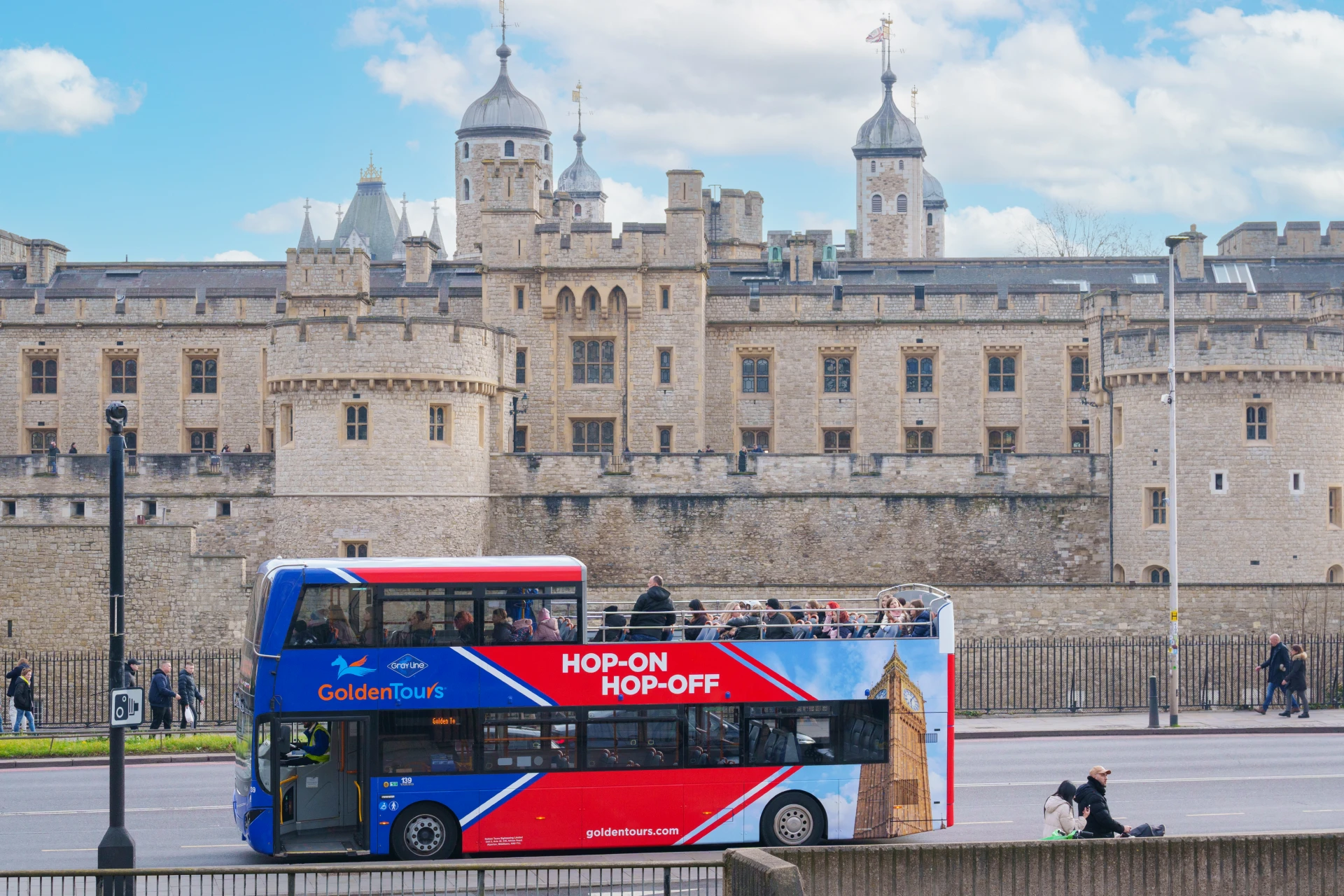 A photo of a Golden Tours branded coach parked.