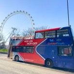 Golden Tours Hop-on Hop-off bus in front of the London Eye