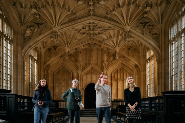 Group in the Divinity School with good view of ceiling