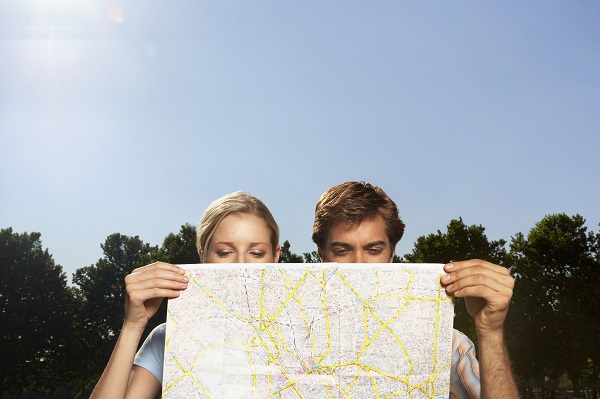 http://www.dreamstime.com/stock-photography-vacationing-couple-looking-large-map-closeup-park-image31836082