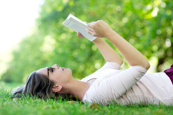 http://www.dreamstime.com/stock-photos-summer-woman-reading-outdoors-image26613583