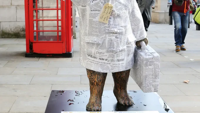 A photo of a statue of Paddington Bear in London.