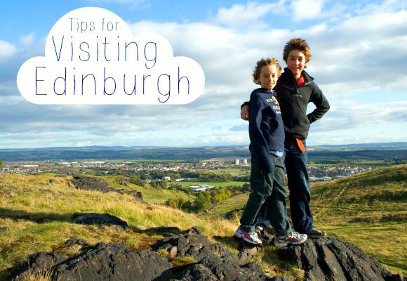 Two children standing on a rocky hillside. Text reads 'Tips for Visiting Edinburgh'.