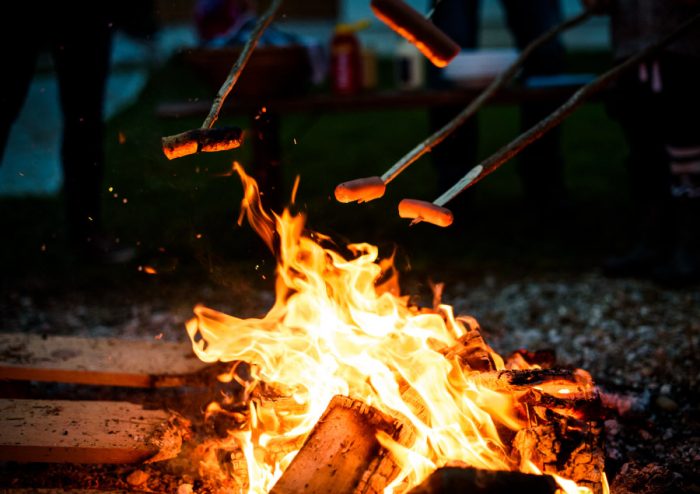 Cooking sausages on a bonfire