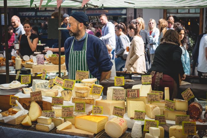 A cheese monger at Broadway Market, Hackney