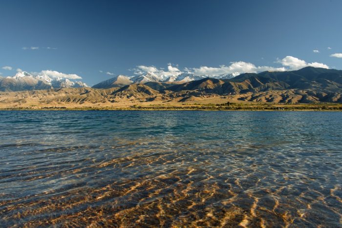 The crystal clear waters of Lake Issyk Kul, Kyrgyzstan