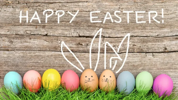 A photo of Easter Eggs against a wall with the text "Happy Easter!"