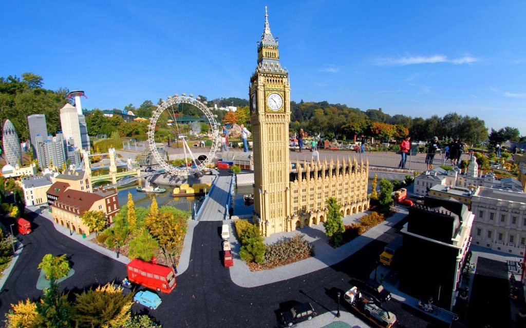 A photo of a replication of Westminster at Legoland - it shows Big Ben and the London Eye made of Lego.