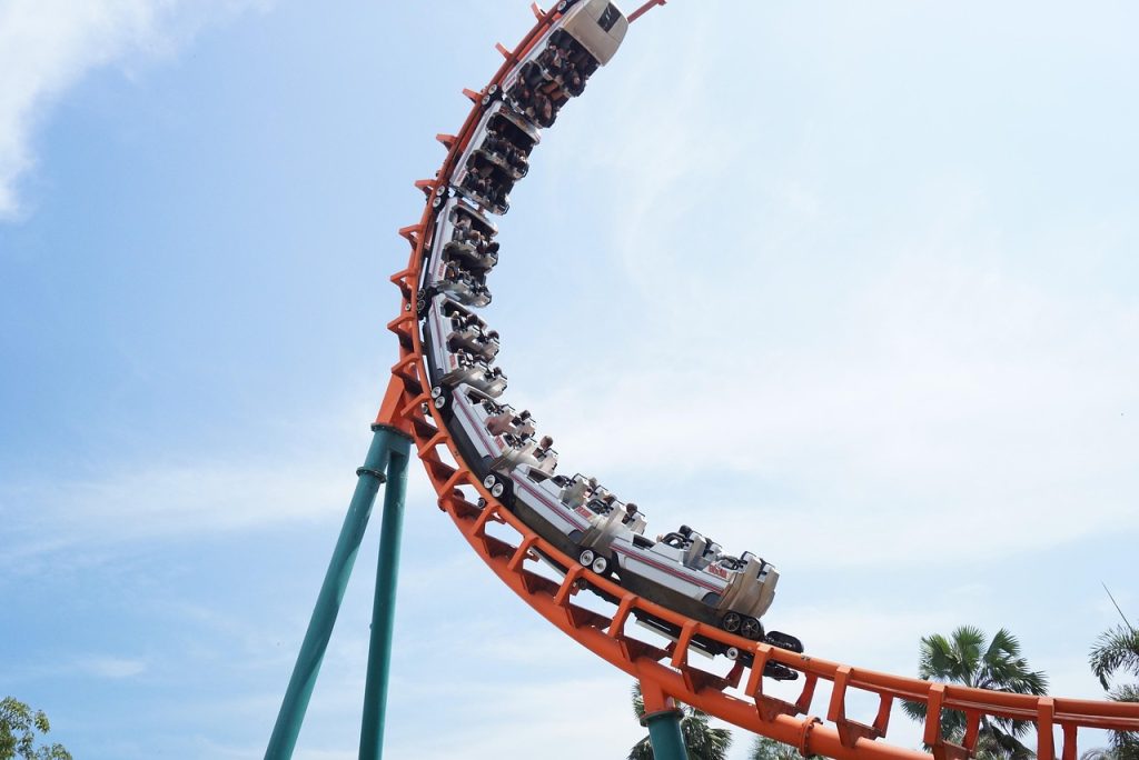 A photo of a rollercoaster going into a loop.